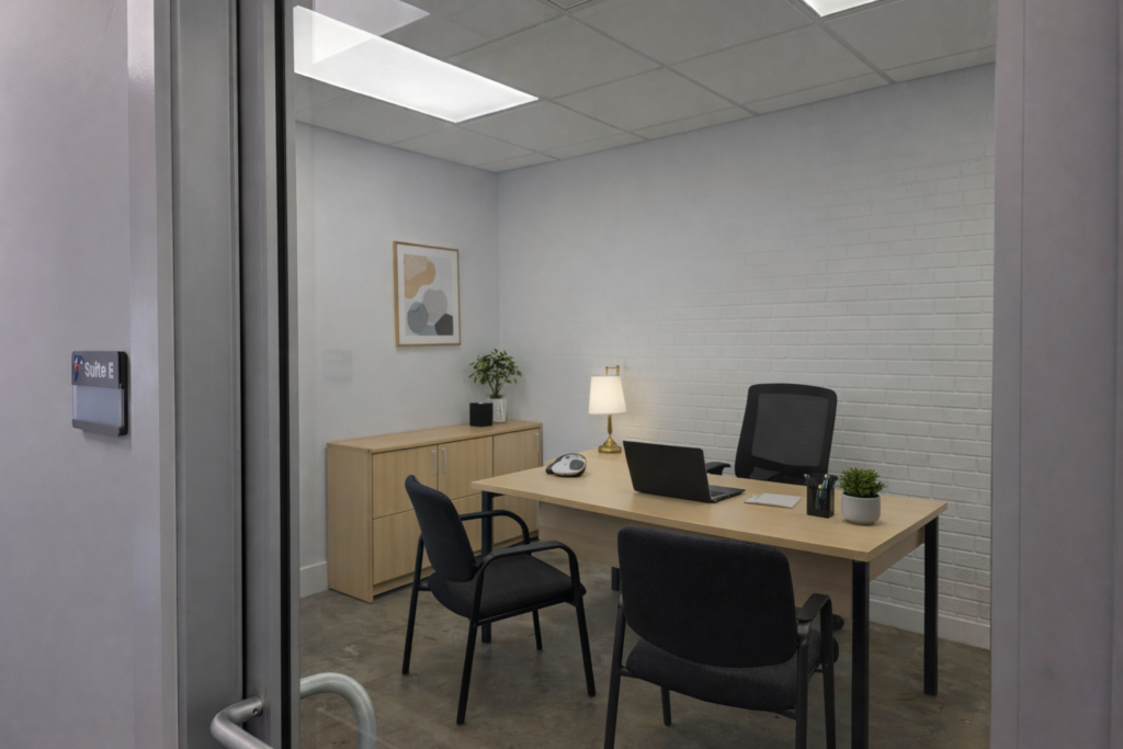 A spacious open office layout featuring desks, chairs