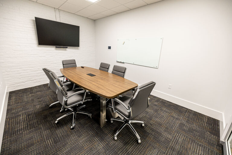 A spacious open office layout featuring desks, chairs